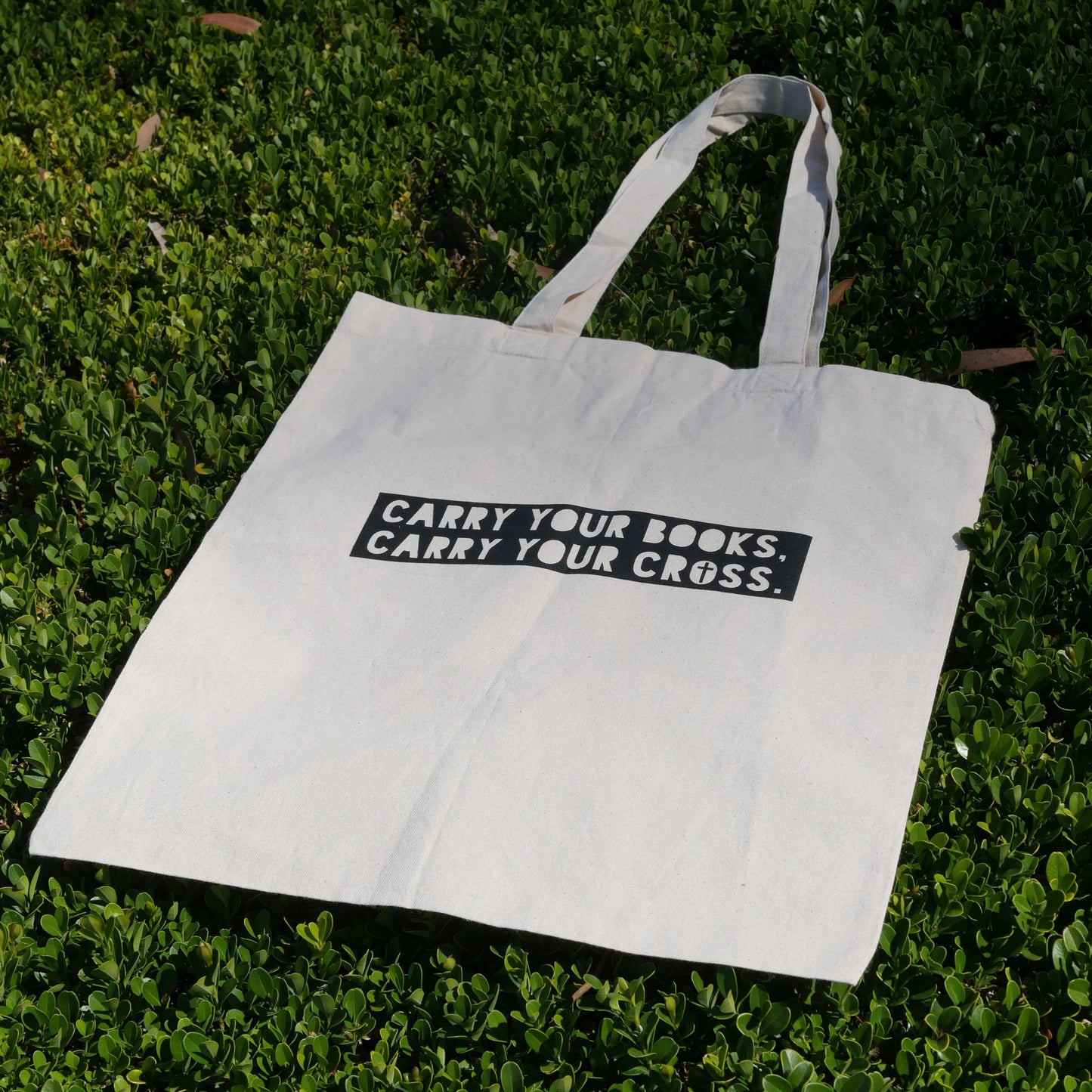 CARRY YOUR BOOKS CARRY YOUR CROSS TOTE